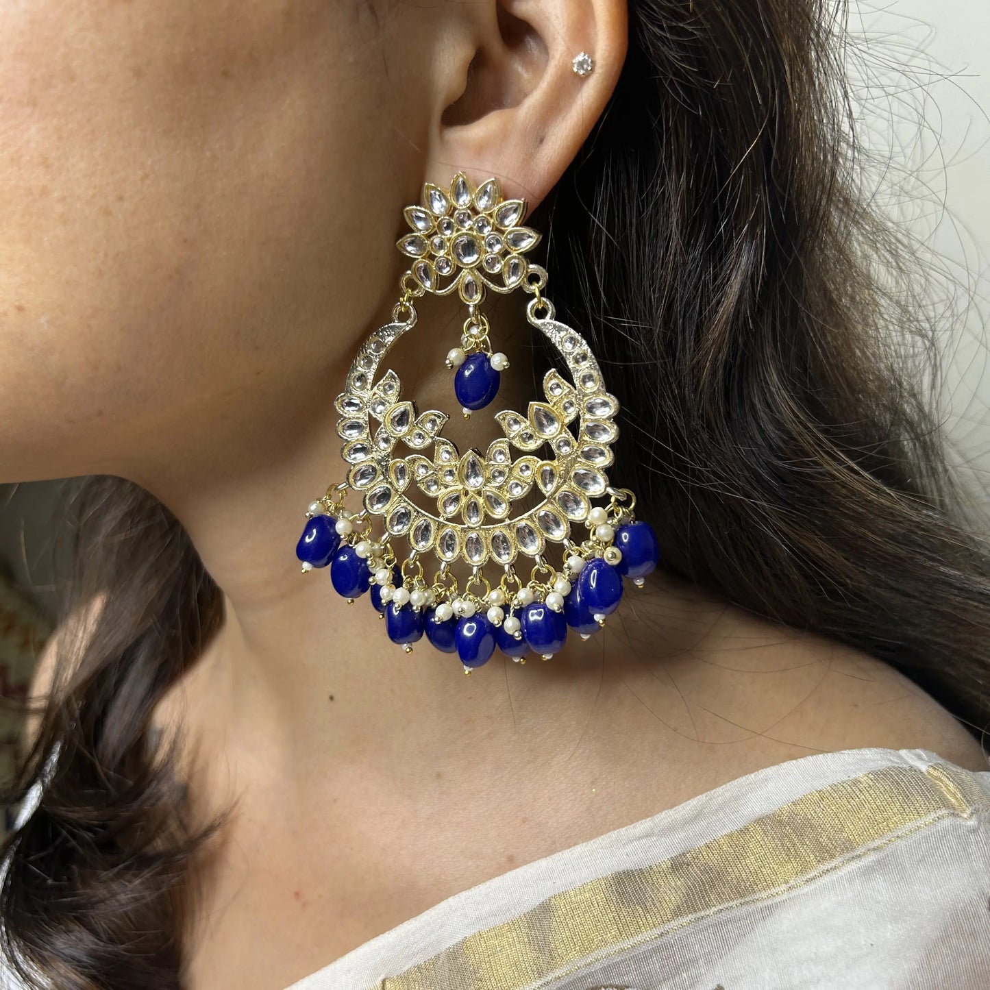 Rubaan Jadau Jhumka with Gold base and Blue Dangling Beads